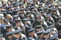  ??  ?? Law officers salute during the outdoor portion of Peoria police officer Jason Judd’s funeral service at Christ’s Church of the Valley in Peoria on Tuesday. DAVID WALLACE/ THE REPUBLIC