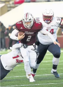  ?? ASSOCIATED PRESS VIA THE REPUBLICAN ?? NOT ENOUGH: Ross Comis rushed for a touchdown yesterday against Brigham Young, but UMass dropped a 35-16 decision at Gillette Stadium.