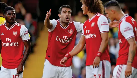  ?? AP ?? No case for the defence: Sokratis lets rip as David Luiz, Granit Xhaka and (left) Ainsley Maitland-Niles join the inquest at Watford