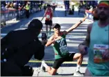  ?? PHOTO BY AXEL KOESTER ?? Ivan Mayorga poses Sunday after crossing the finish line of the 39th Los Angeles Marathon.