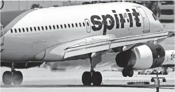  ?? JOE RAEDLE, GETTY IMAGES ?? Spirit Airlines is one of the worst offenders, charging passengers up to $100 for a carry-on bag.