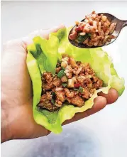  ?? AMERICA’S TEST KITCHEN/AP] [PHOTO BY CARL TREMBLAY, ?? This recipe for Asian Chicken Lettuce Wraps appears in the cookbook “Complete Diabetes.”