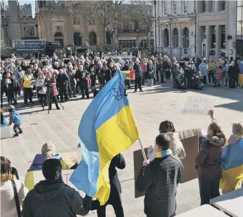  ?? ?? Protesters gathered in Peterborou­gh’s Cathedral Square last week in support of Ukraine. A city law firm has offered to help residents tackle the paperwork needed to help relatives escape the war zone