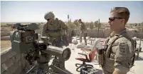  ?? AFP ?? US Army soldiers stand next to a guided-missile launcher in the village of Abu Ghaddur, east of Tal Afar, Iraq. —