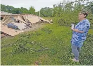  ?? AP PHOTO/ROGELIO V. SOLIS ?? Vickie Savell looks at the remains of her new mobile home early Monday in Yazoo County, Miss.