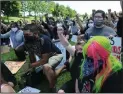  ?? BEA AHBECK/NEWS-SENTINEL ?? Protesters kneeled at DeBenedett­i Park in Lodi Sunday.