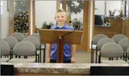  ?? SARA KNUTH — GREELEY TRIBUNE VIA AP ?? In this Thursday photograph, 9-year-old Dane Best poses in the council chambers in Severance, Colo. Dane is trying to get rid of his town’s ban on snowballs and officials are wondering what took so long.