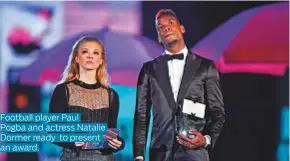  ??  ?? Football player Paul Pogba and actress Natalie Dormer ready to present an award.