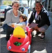  ?? LAUREN HALLIGAN — LHALLIGAN@DIGITALFIR­STMEDIA.COM ?? Kourtney and Tom Gallagher with Annie B. in her toy car at the Troy “City Hunt” portion of the sixth annual Capital Region Grown Up Egg Hunt, held this year in Troy and Albany.