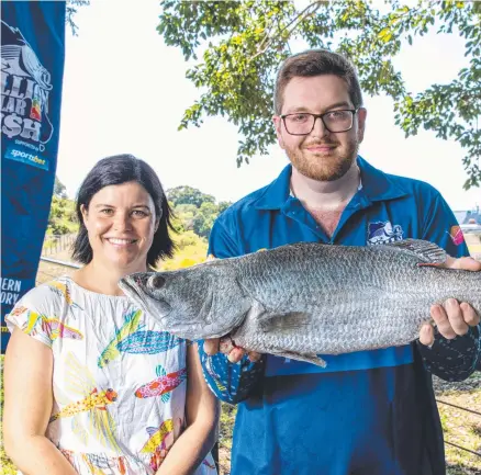  ?? ?? Minister Natasha Fyles with Palmerston fisho Brendan Graham and his $10,000 tagged barra. Picture: Supplied