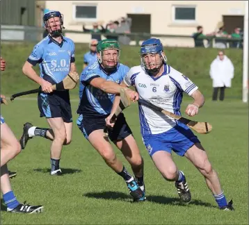  ??  ?? Craanford’s Patrick Murray looks to go past Liam Rochford of St. Anne’s.