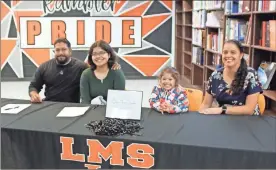  ?? Contribute­d ?? LaFayette Middle School student Selene Torres Mosqueda is joined by parents Alex Torres and Monica Mosqueda and her sister Eliza Torres Mosqueda during her REACH Georgia scholarshi­p signing ceremony last month.