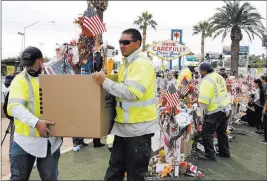  ??  ?? About 200 people attended an emotional farewell ceremony Sunday preceding the removal of memorial items for transporta­tion to the Clark County Museum in Henderson.