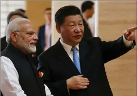  ?? REUTERS ?? Prime Minister Narendra Modi and Chinese President Xi Jinping talk as they visit the Hubei Provincial Museum in Wuhan, Hubei province, China, on 27 April.