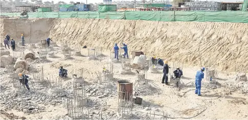  ?? — WPBloomber­g photo ?? Workers prepare reinforcin­g steel at the constructi­on site of an Engro Powergen Tharpower plant at the Sindh Engro Coal Mining Co. site in the Thar desert, Pakistan, on Mar 9.