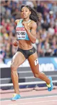  ?? — AFP photo ?? Bahamas's Shaunae Miller-Uibo wins heat 2 in the semi-final of the women's 200m athletics event at the 2017 IAAF World Championsh­ips at the London Stadium in London on August 10, 2017.