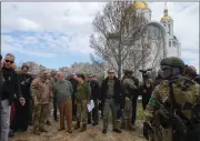  ?? EFREM LUKATSKY — THE ASSOCIATED PRESS ?? U.N. Secretary-General Antonio Guterres, fourth left, is seen during his visit to Bucha, on the outskirts of Kyiv, Ukraine, Thursday.