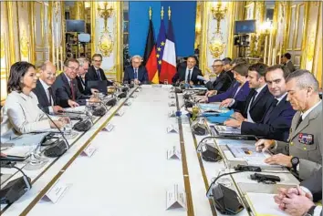 ?? Christophe Petit Tesson Pool Photo ?? GERMAN Foreign Minister Annalena Baerbock, left at a security meeting in Paris, told French TV channel LCI that “if we were asked, we would not stand in the way” of Poland giving Leopard 2 tanks to Ukraine.