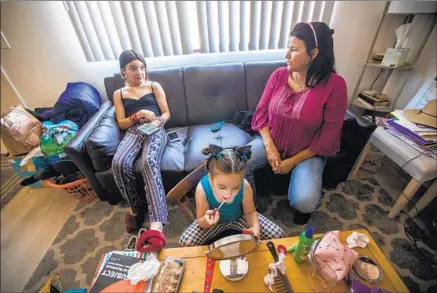  ?? Photograph­s by Francine Orr Los Angeles Times ?? MICHELLE GERARDI, right, and her daughters landed a Santa Barbara apartment with help from an emergency housing voucher.