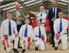  ?? ?? CHAMPION HANDLER and overall champion, back Alison Lawrie, pictured with sponsor Archie Leitch from Almins (left), and judge Max Davie (right). Front row from left, Rory Scott, John Caldwell, Katie Watson and Neil Sloan