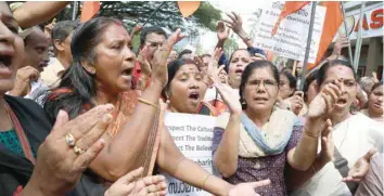  ??  ?? Activists protest following the arrest of devotees at Sabarimala temple in Kochi.— AFP