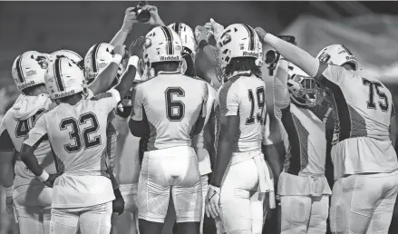  ?? JIM RASSOL/THE PALM BEACH POST ?? Palm Beach Central gathers before the start of the 4M region final against Monarch at Coconut Creek High School in Coconut Creek on Friday.