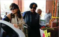  ?? — AFP ?? In this photograph taken on March 12, 2012, Shashi Tharoor with his wife Sunanda Pushkar arrive at parliament in New Delhi.