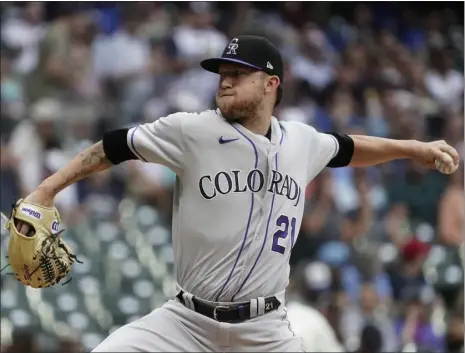  ?? MORRY GASH — THE ASSOCIATED PRESS ?? Colorado Rockies starting pitcher Kyle Freeland throws during the first inning against the Brewers on Monday in Milwaukee.