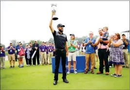  ?? ASSOCIATED PRESS ?? TROY MERRITT holds up his trophy after winning the rain-delayed Barbasol Championsh­ip golf tournament at Keene Trace Golf Club in Nicholasvi­lle, Ky., Monday.