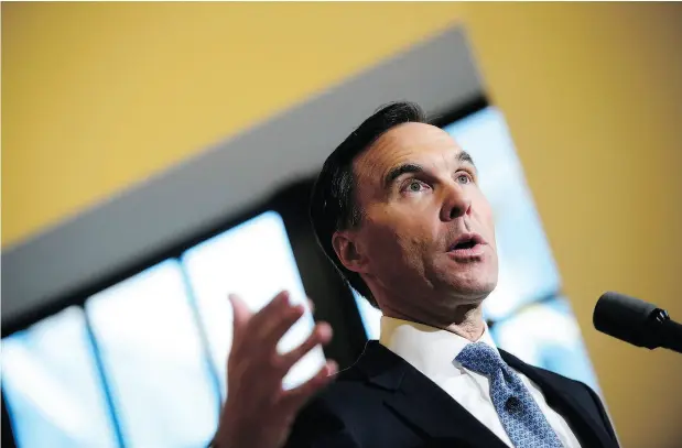  ?? SEAN KILPATRICK / THE CANADIAN PRESS ?? Finance Minister Bill Morneau holds a press conference in the media lockup for the fall economic update, in Ottawa on Wednesday.