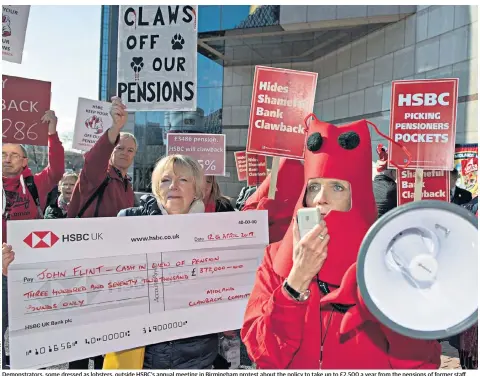 ??  ?? Demonstrat­ors, some dressed as lobsters, outside HSBC’S annual meeting in Birmingham protest about the policy to take up to £2,500 a year from the pensions of former staff
