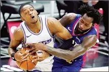  ??  ?? Los Angeles Clippers guard Patrick Beverley, (right), defends against Sacramento Kings guard De’Aaron Fox during the first quarter of an NBA basketball game, Jan 20, in Los Angeles. (AP)