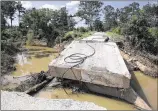  ?? DEBORAH CANNON / AMERICAN STATESMAN ?? The Alum Creek Road bridge, about a half-mile south of Park Road 1C, was washed out, said Bastrop County’s emergency coordinato­r.