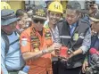  ?? | AP ?? CHIEF of National Search and Rescue Agency Muhammad Syaugi, centre, holds the flight data recorder from the crashed Lion Air jet in Tanjung Karawang, Indonesia, yesterday.