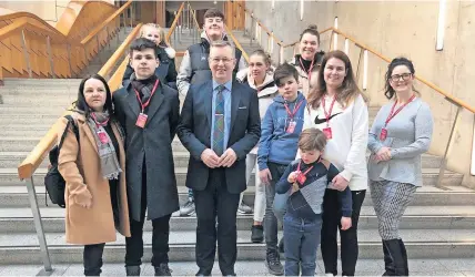  ?? ?? Visit A course for the young people aged 11-16 not attending high school, to support them and give them the skills and qualificat­ions to help them throughout their life, was given a boost when Alexander Stewart MSP invited them and parents/grandparen­ts to Holyrood