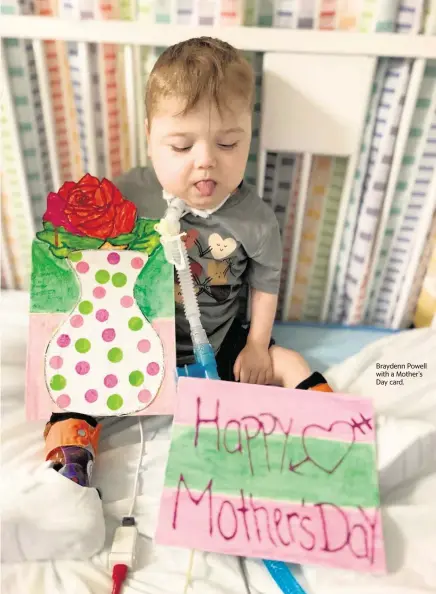  ?? ?? Braydenn Powell with a Mother’s Day card.