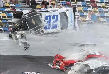  ?? JOE BURBANK/ORLANDO SENTINEL/MCT ?? Kyle Larson’s car flies through the air in a dramatic last-lap accident at Daytona in February.