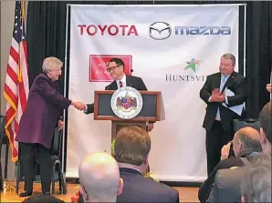  ?? REUTERS ?? Alabama Governor Kay Ivey (left) shakes hands with Toyota Motors President Akio Toyoda at an event announcing the building of a $1.6 billion assembly plant with Mazda in Alabama on Jan 10.