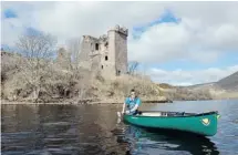  ??  ?? Boots N Paddles guide Dan Maggs leads a canoeing group on Loch Ness past Urquhart Castle.