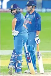  ?? AP ?? It remains to be seen if Rohit Sharma (left) sends MS Dhoni to bat at No 4 again on Sunday.