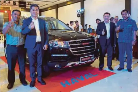  ??  ?? (From left) Go Auto chief executive officer Ahmad Azam Sulaiman, PT Makmur Andalan Indonesia director Sudry Aliyanto, PT Nusa Jaya Mobilindo director Acun and Kota Batam industrial and trading department chief Zarefriadi after the launch of Haval...