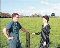  ??  ?? Handy advice: Janine Broekhuize­n explains the Dairy Connect process to farmer Lief Tumai.