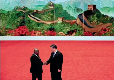  ?? AP ?? Ghana’s President Nana Akufo-addo, left, shakes hands with Chinese President Xi Jinping during the Forum on China-africa Co-operation held at the Great Hall of the People in Beijing.