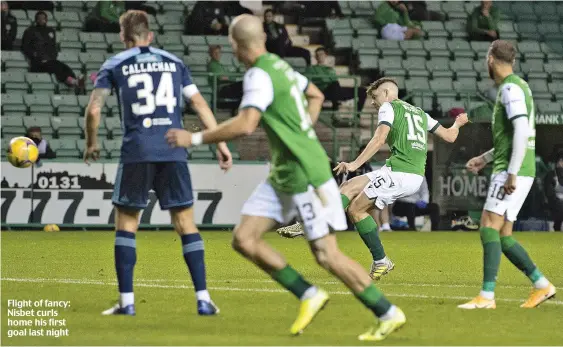  ??  ?? Flight of fancy: Nisbet curls home his first goal last night