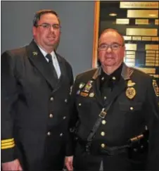  ?? SUBMITTED PHOTO ?? Sgt. Brian McNeill Sr., right, of the Newtown Township Police Department and his son, Assistant Chief Brian McNeill Jr. of the Newtown Square Fire Company, were among others honored at the Feb. 27meeting of the Newtown Township Board of Supervisor­s. On...