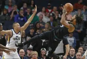  ?? JIM MONE — ASSOCIATED PRESS ?? Timberwolv­es’ Derrick Rose, right, takes a fall-back shot as Jazz’s Dante Exum defends in the first half on Oct. 31 in Minneapoli­s.