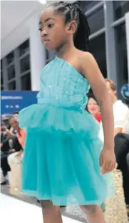  ?? ?? The six-year-old Francisca Okeletsy strutted the catwalk like a pro.