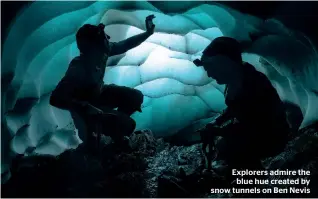  ?? ALASTAIR TODD ?? Explorers admire the blue hue created by snow tunnels on Ben Nevis