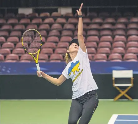  ?? MAYA CARTER/ ASHEVILLE CITIZEN TIMES ?? Ukraine’s Katarina Zavatska, practicing Tuesday in Asheville, says of the war back home, “There is no one day that we don’t think about it. ... But on the other side, we just have to live.”