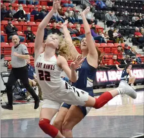  ?? TIMES photograph­s by Annette Beard ?? Senior Lady Blackhawk Blakelee Winn pulled off a great steal, driving to sink a layup with less than a second left in the third quarter. She was fouled while making her shot, with the senior forward swishing the free shot to send the Hawks into the final period with a 39-34 lead.